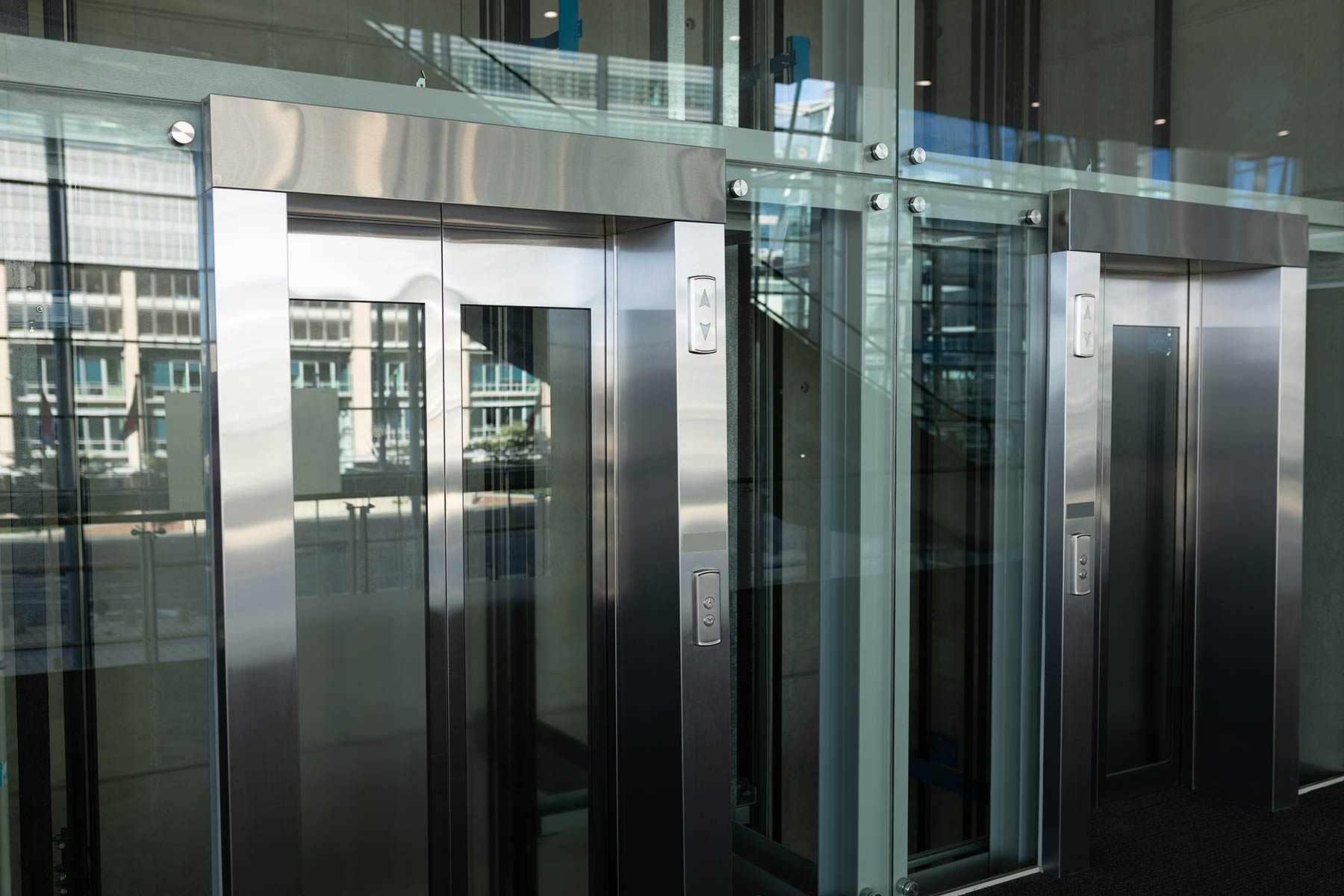 Fud Waelzlager Solutionsside View Of Two Modern Elevators In A Workplace 2026 01 09 10 37 02 Utc